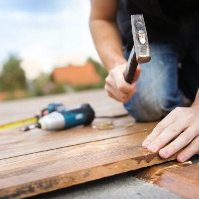 handyman-installing-wooden-flooring